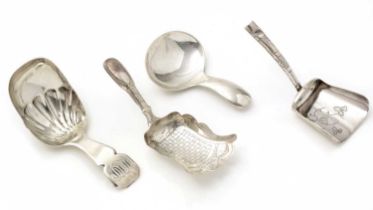 A George III silver caddy spoon; and three others