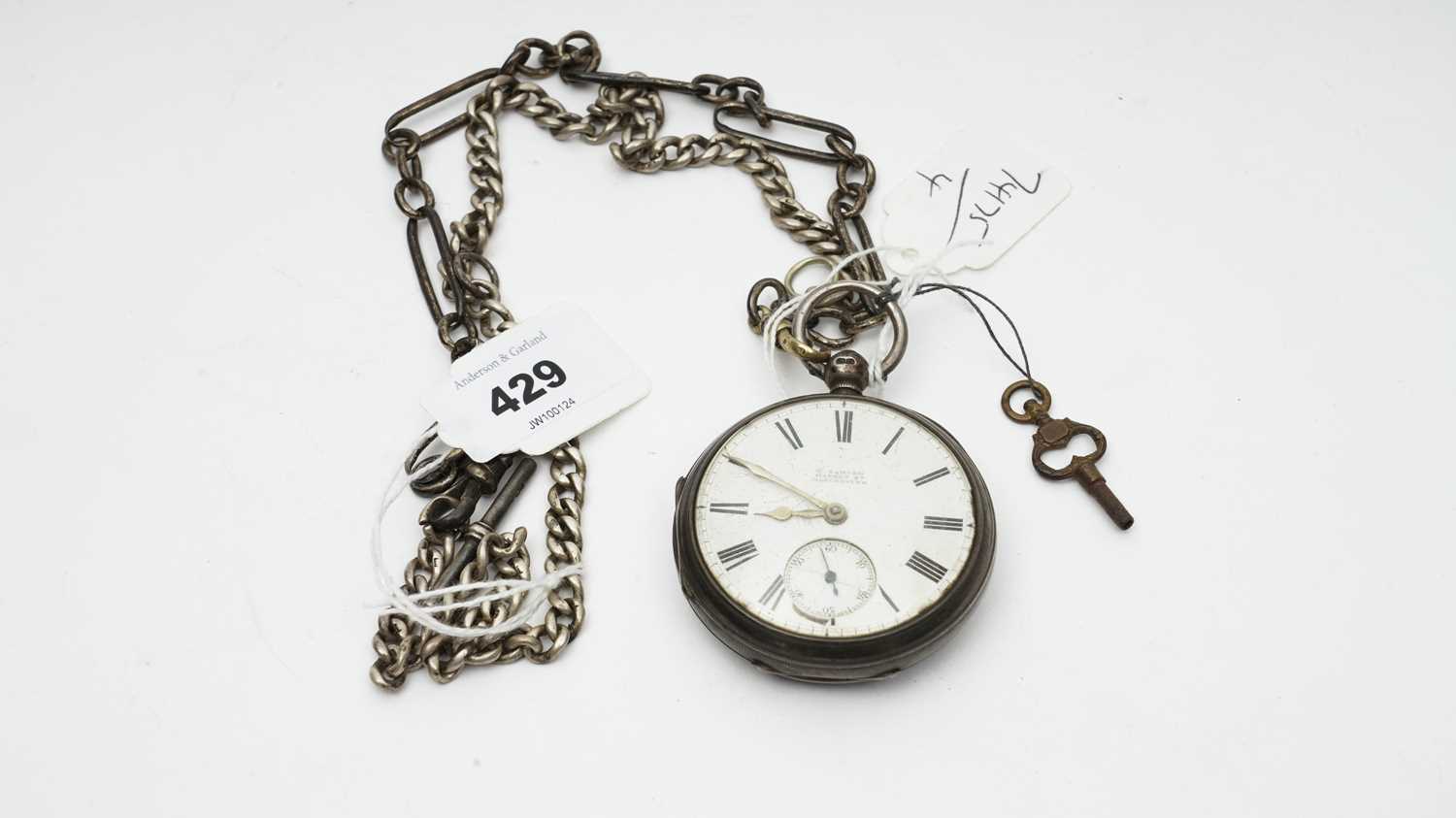 A silver case open-faced pocket watch and chains
