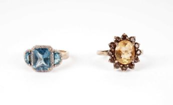 A topaz and diamond ring; and a cluster ring