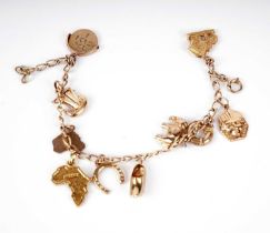 A yellow gold charm bracelet