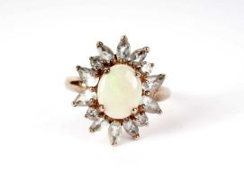 An opal and blue stone cluster ring