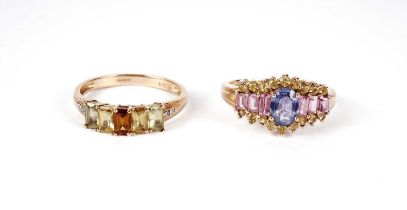 Two coloured gemstone set rings