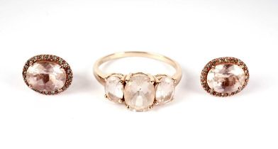 A pink three-stone dress ring; and a pair of earrings