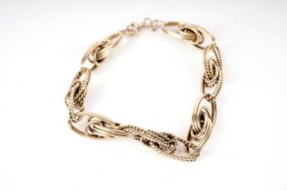 An 18ct yellow gold fancy link chain bracelet