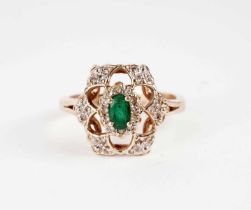 An emerald and diamond dress ring