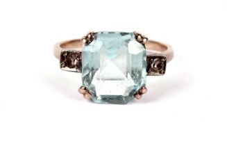 An aquamarine and white sapphire dress ring