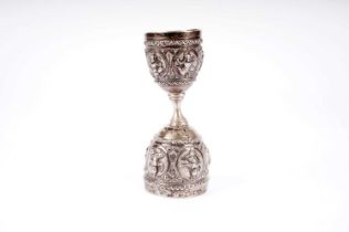 An early 20th Century Indian white metal measure cup