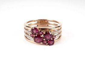 A purple stone and diamond dress ring