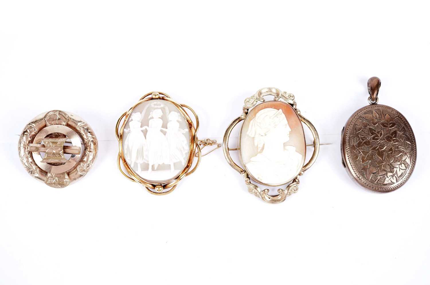 Victorian and later brooches and a locket, including a carved cameo depicting the Three Graces