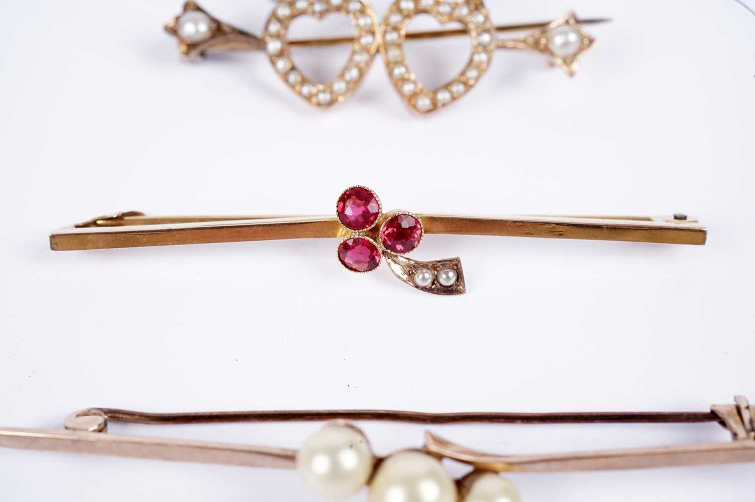 Three bar brooches, including an Edwardian garnet and seed pearl cherry brooch - Image 3 of 5