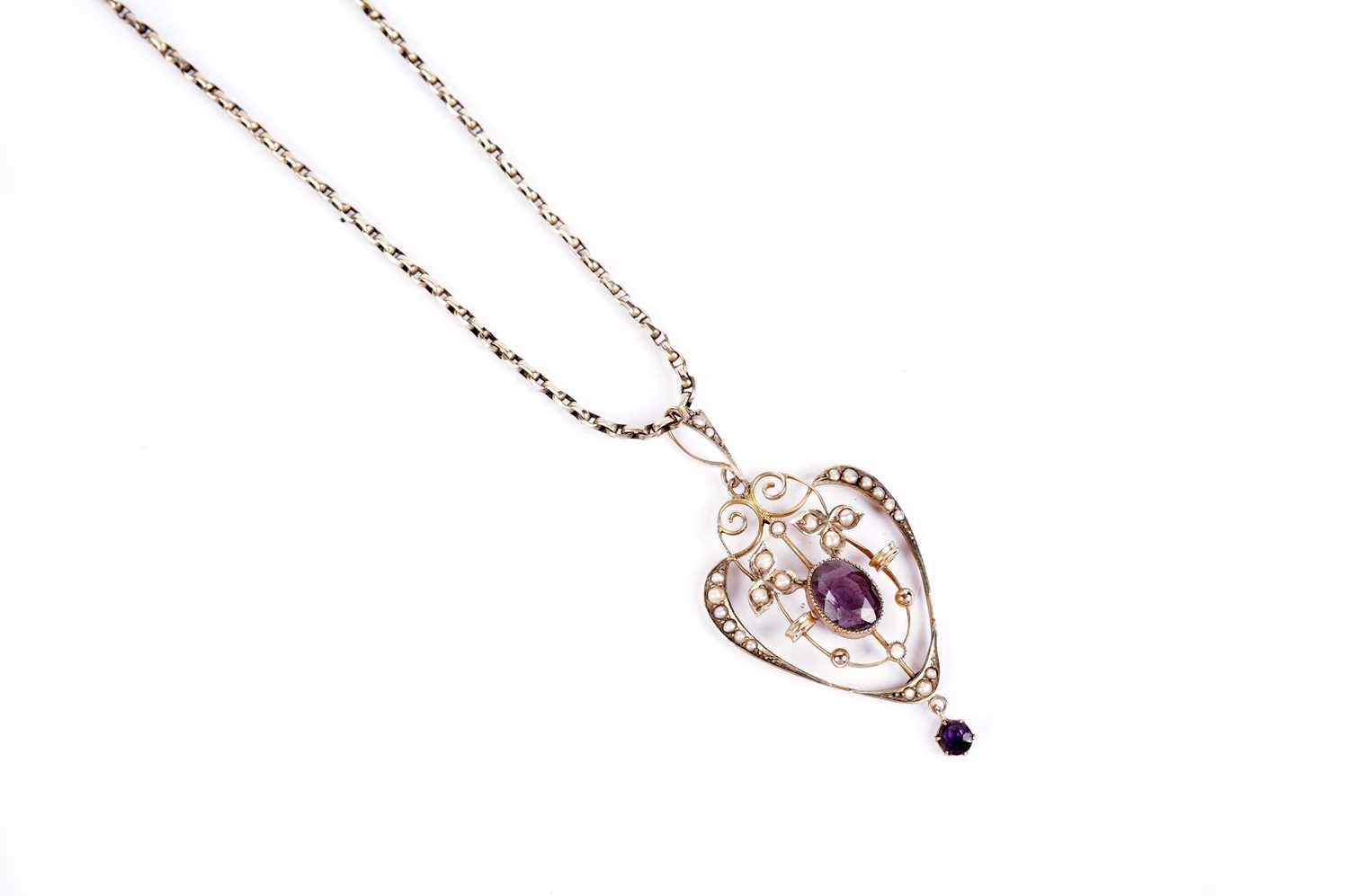 An Edwardian amethyst and seed pearl drop pendant