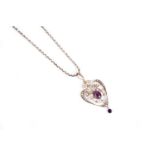 An Edwardian amethyst and seed pearl drop pendant