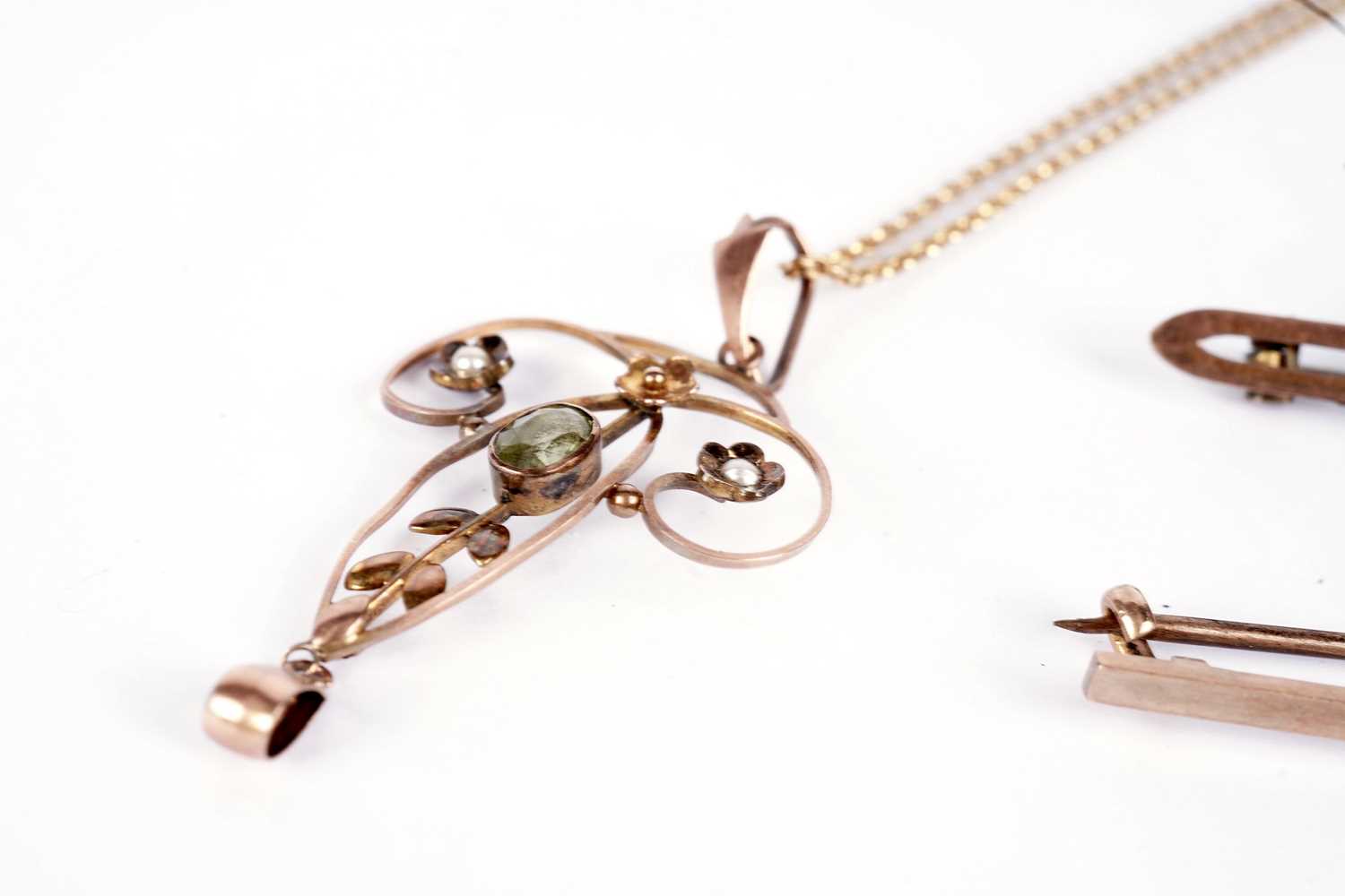 An Edwardian peridot and seed pearl drop pendant; and two brooches - Image 3 of 4