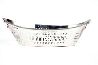 A silver twin handled boat shaped dish
