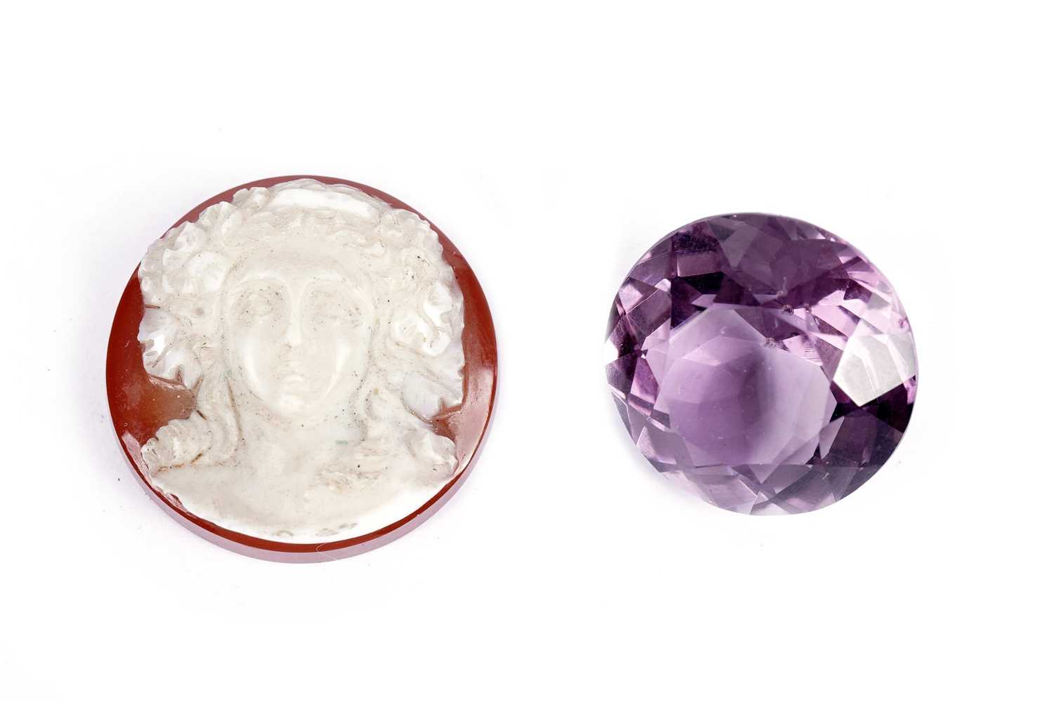 A carved hardstone cameo; and an amethyst