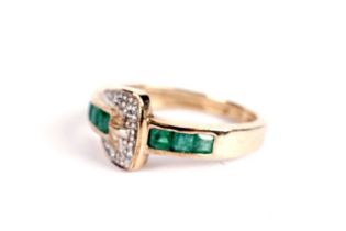An emerald and diamond belt buckle motif ring