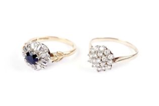 A diamond and sapphire cluster ring; and another cluster ring