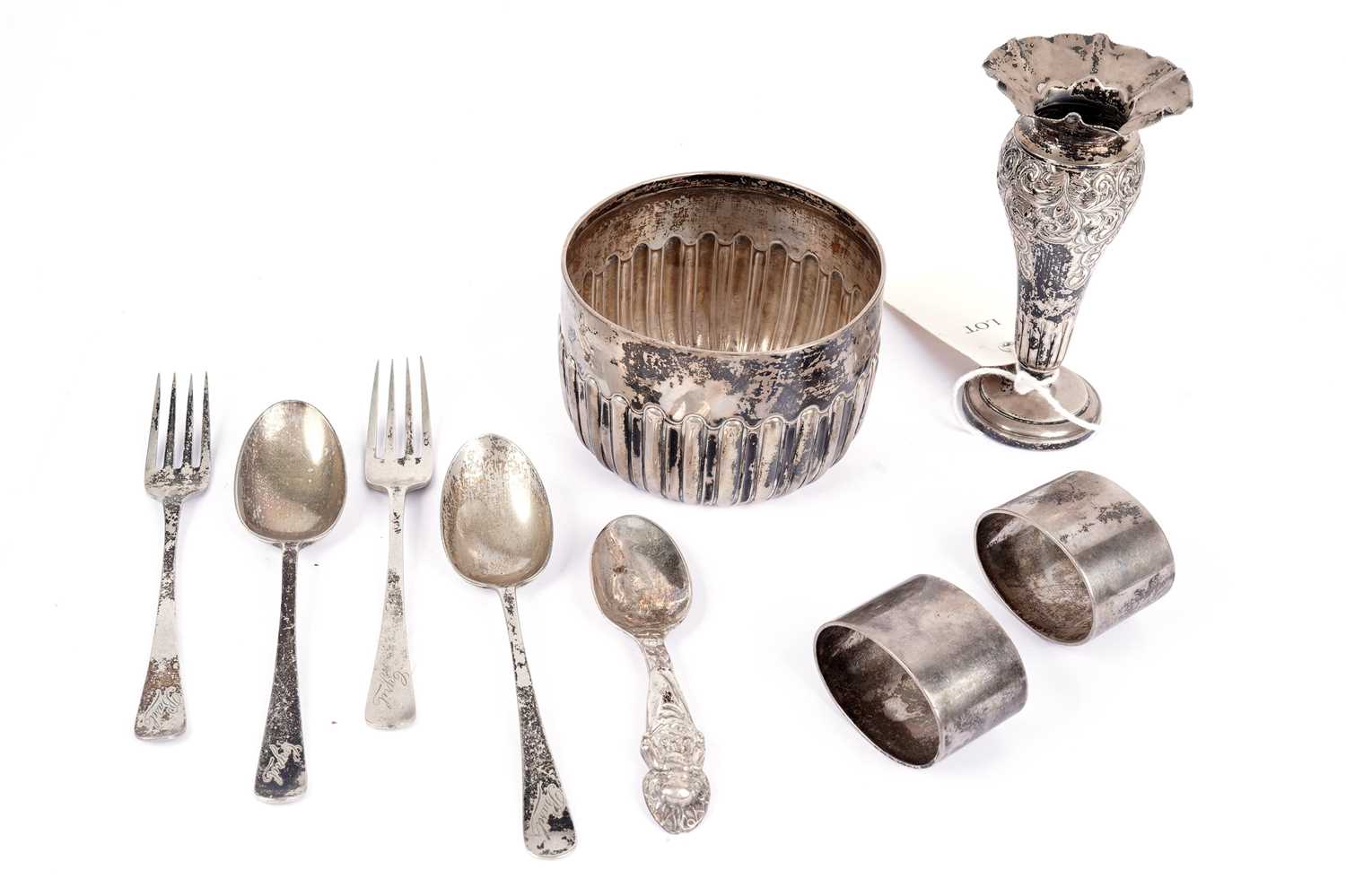 Edwardian silver christening sets and a spill vase