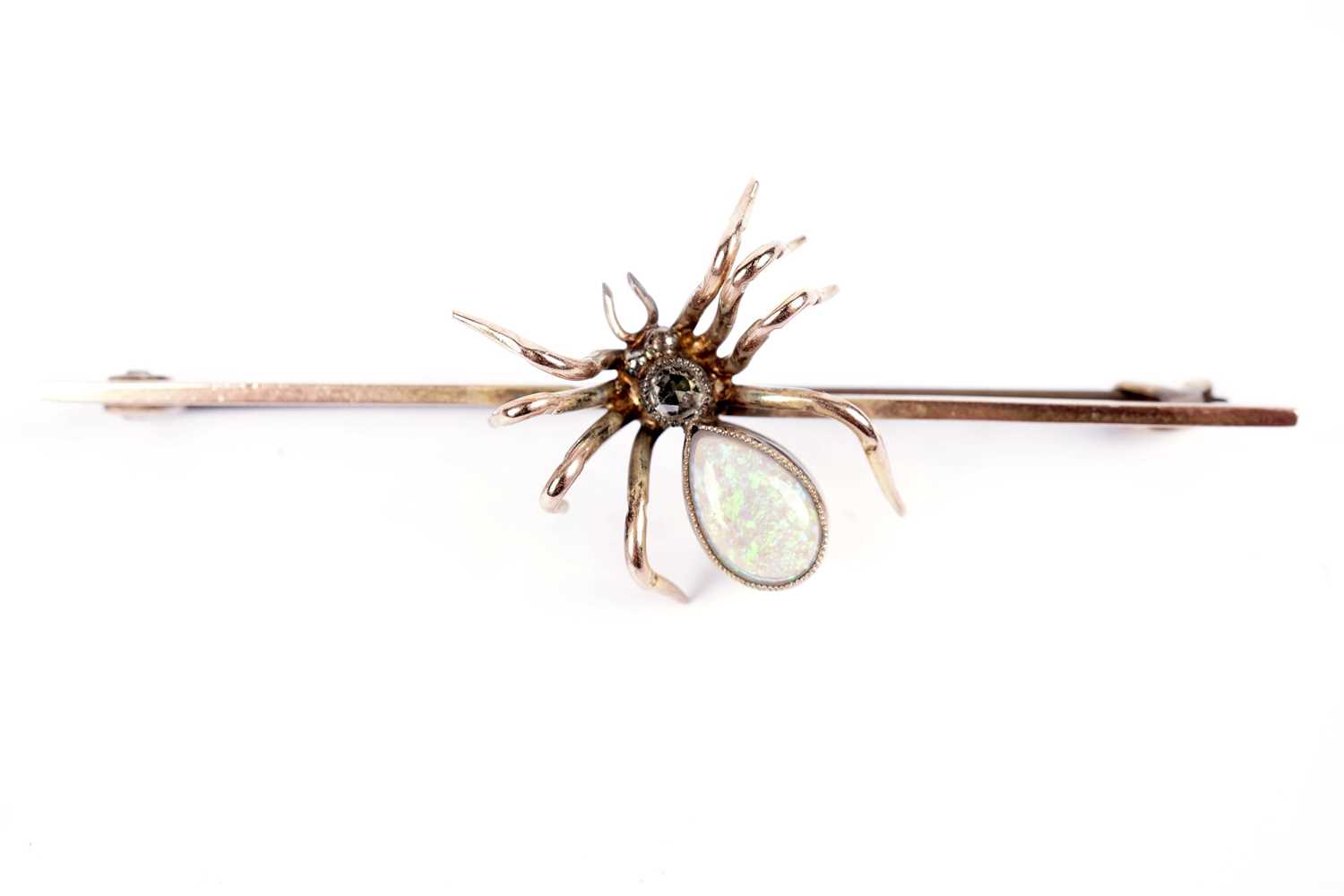 An opal and diamond spider brooch