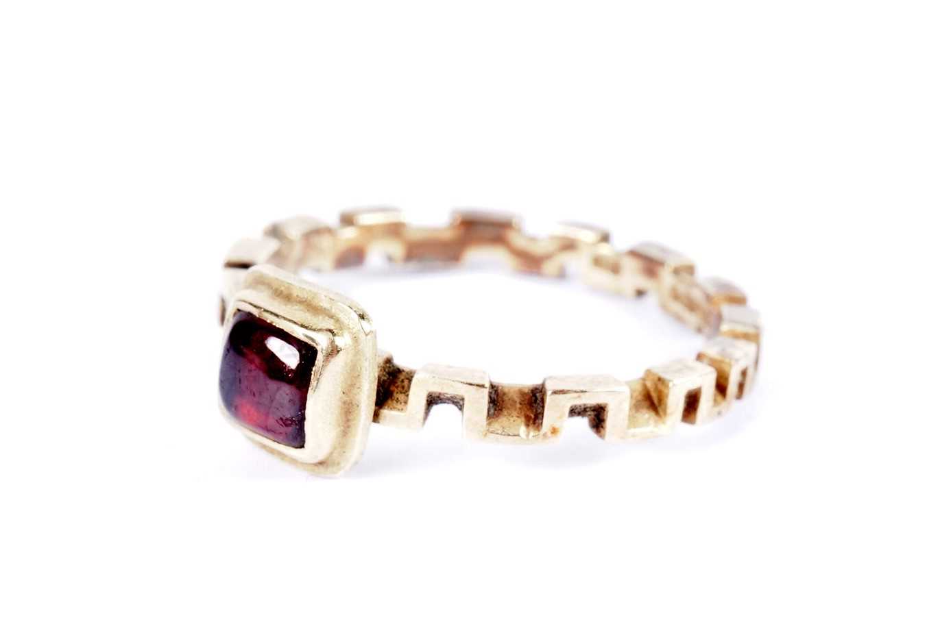 A garnet and 18ct gold ring