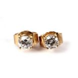 A pair of diamond stud earrings