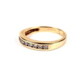 A diamond half hoop eternity ring