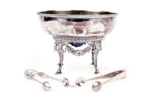 An Edwardian silver circular sugar bowl and stand; with two pairs of sugar tongs
