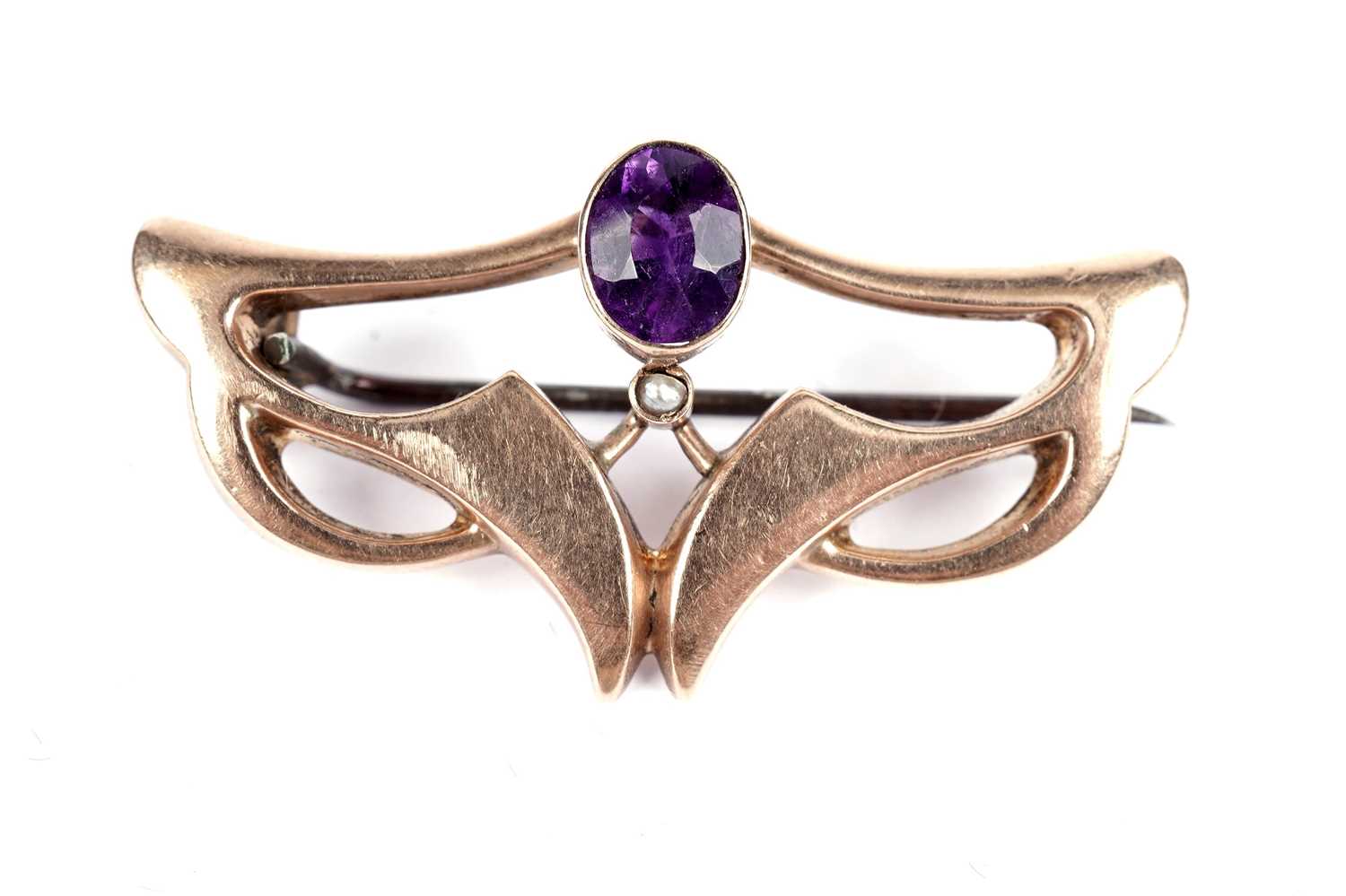 A Secessionist movement amethyst and seed pearl "bat-wing" brooch