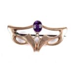 A Secessionist movement amethyst and seed pearl "bat-wing" brooch