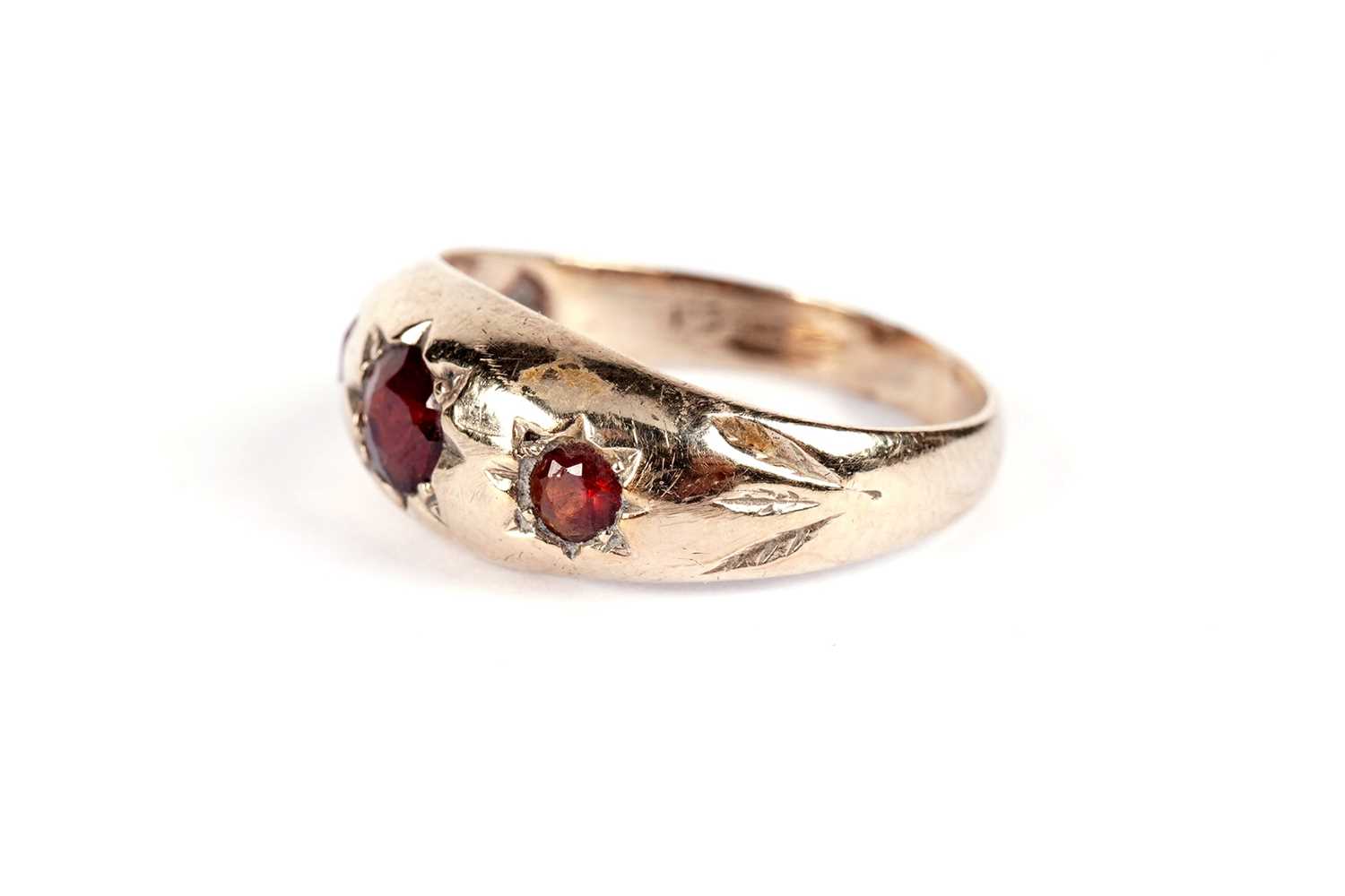 A garnet three stone band; and another garnet ring - Image 5 of 7