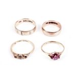 A ruby flower cluster dress ring; and three others