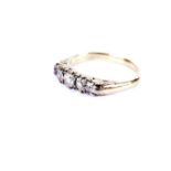 A diamond five stone ring