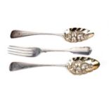 A pair of silver spoons and a silver table fork