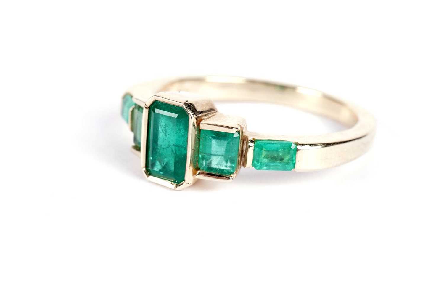 An emerald five-stone ring