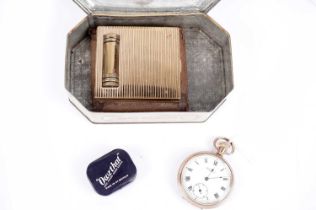 The Consol gold plated open face pocket watch; and a powder compact