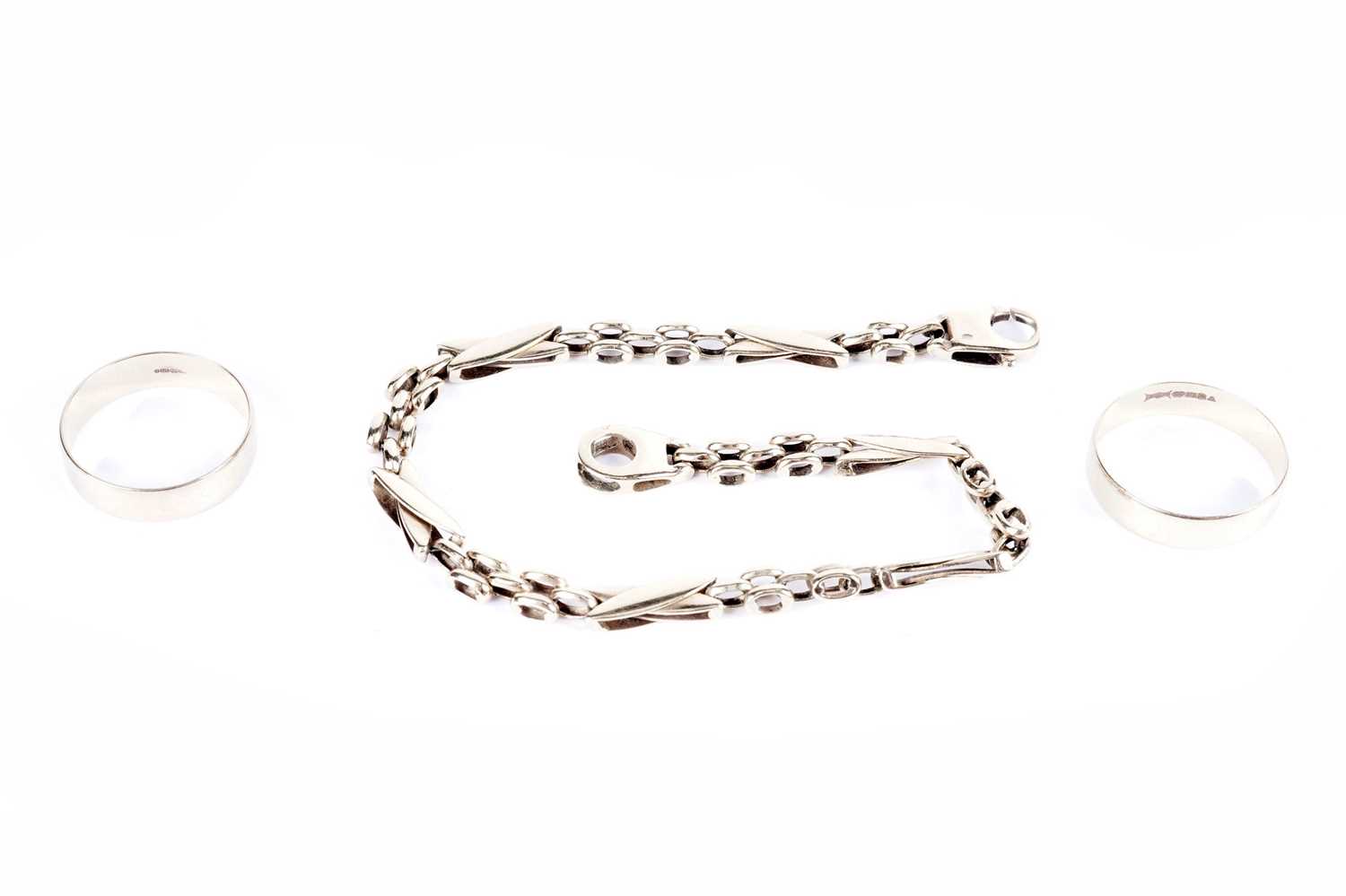 A 9ct yellow gold fancy link chain bracelet; and two gold rings