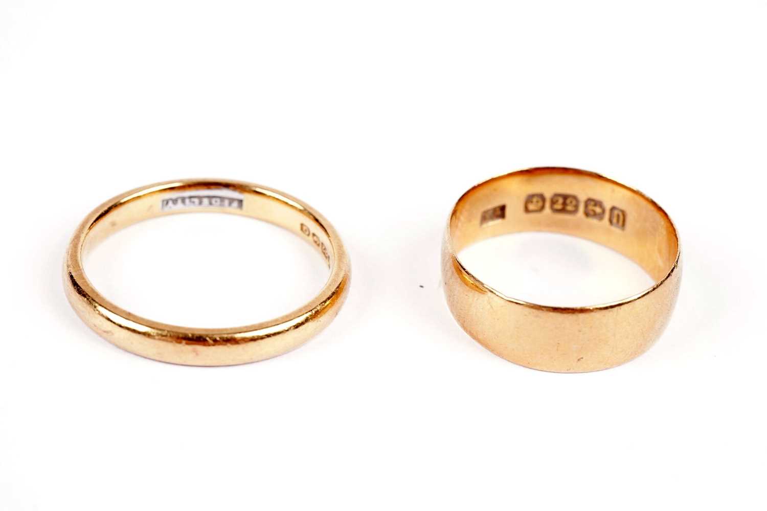 Two 22ct yellow gold wedding bands,