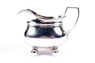 A Victorian silver cream jug, by Holland, Son & Slater