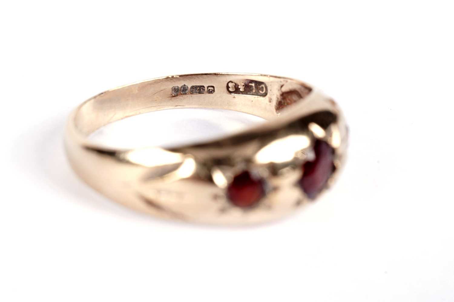 A garnet three stone band; and another garnet ring - Image 7 of 7