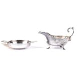 An early 20th Century silver quaich; and a silver sauce boat