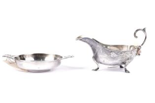 An early 20th Century silver quaich; and a silver sauce boat