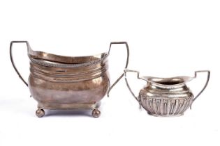 A George III silver two handled sugar bowl; and another smaller
