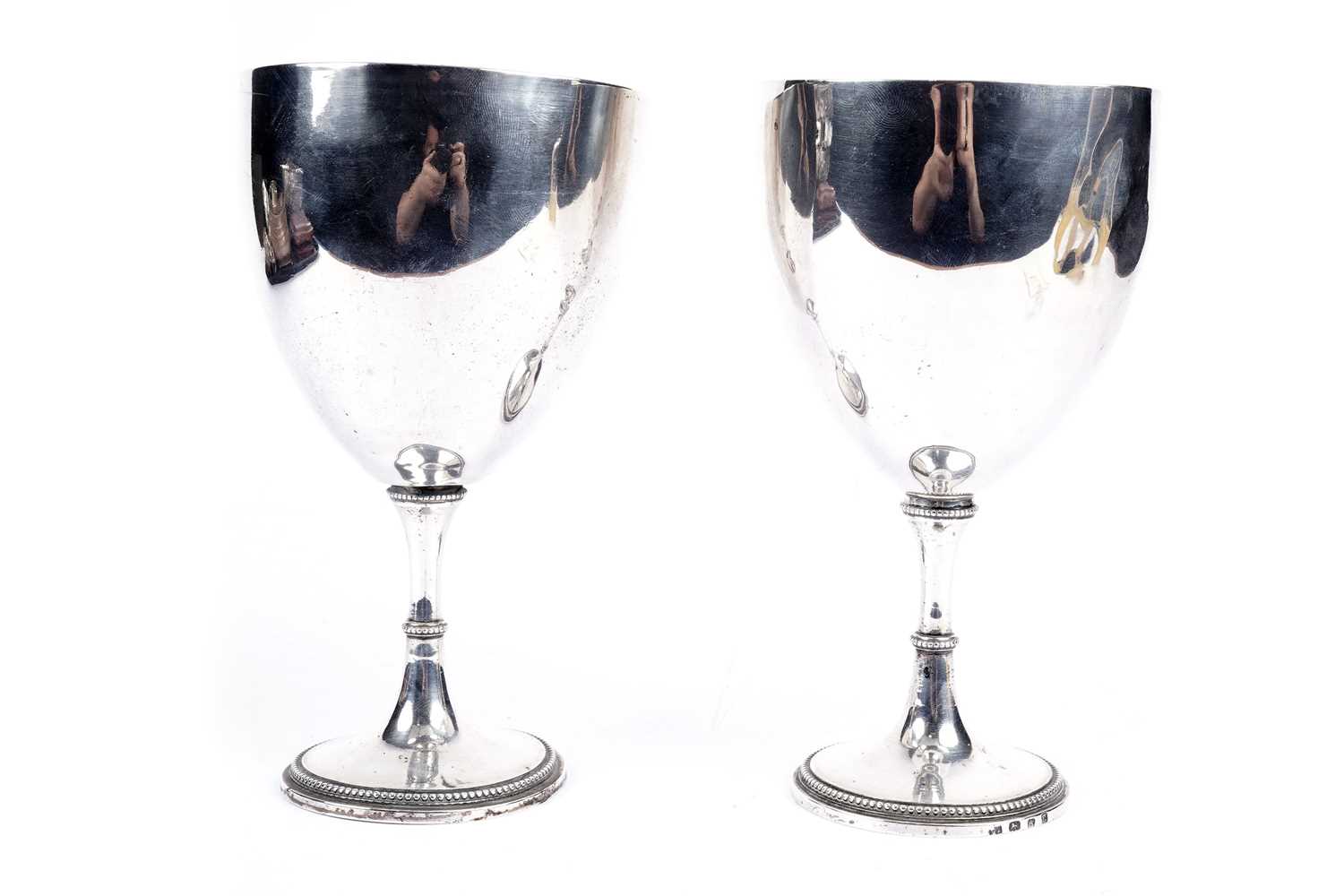 A pair of George IV silver chalices