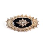 A Victorian seed pearl, black enamel and gilt metal mourning brooch