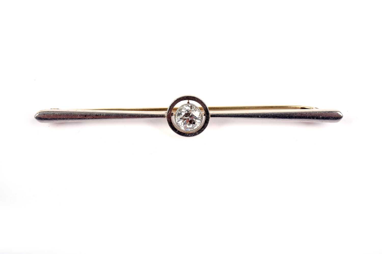 A diamond bar brooch