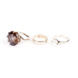 Three rings including a smoky quartz dress ring