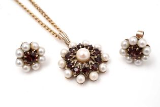 A garnet and cultured pearl pendant and a pair of similar earrings