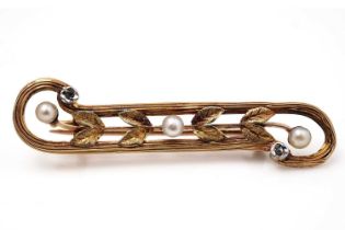 An early 20th Century gold, diamond and pearl brooch