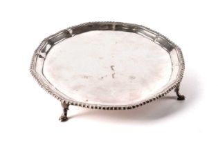 A silver salver, by Harrods Ltd