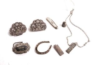 A silver belt buckle, and other items